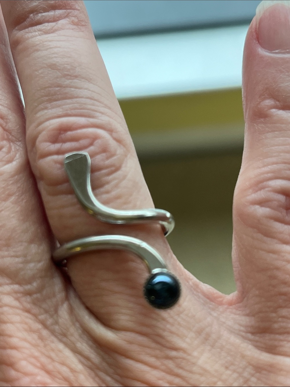 Silver ring with black stone